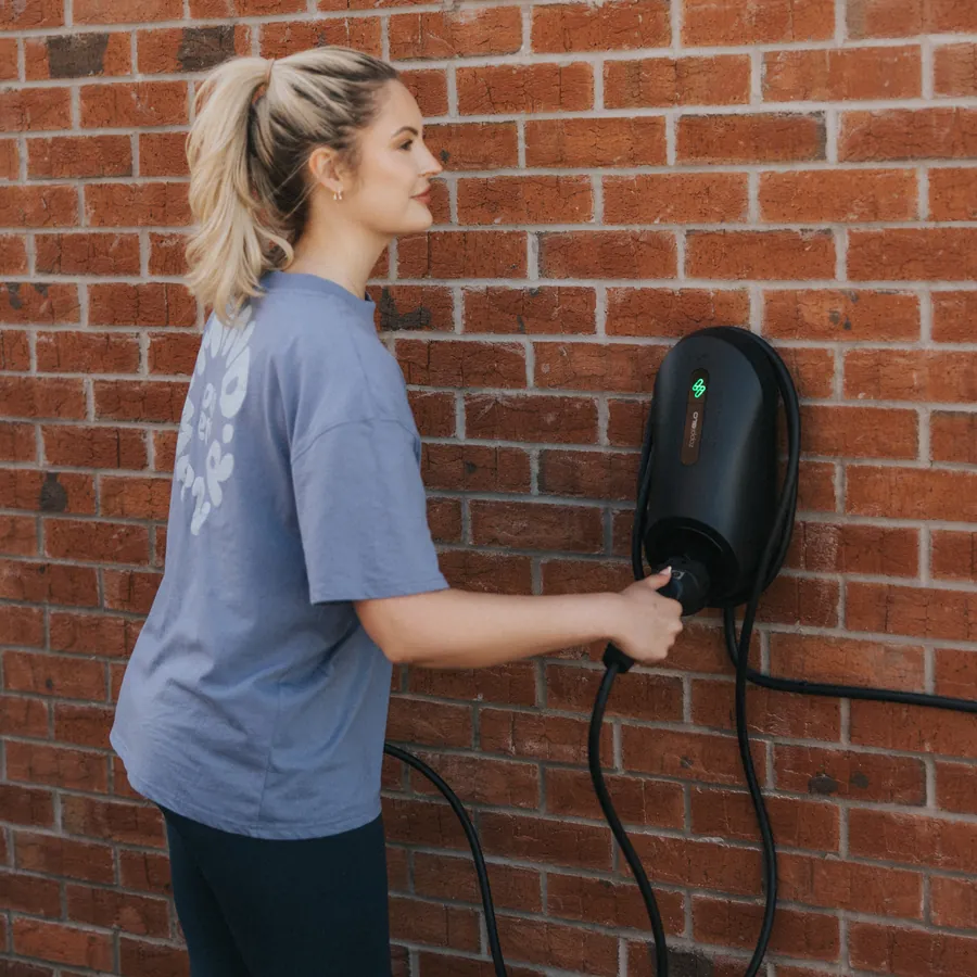 Homeowner charging an electric car with a zappi GLO charger in Nottingham