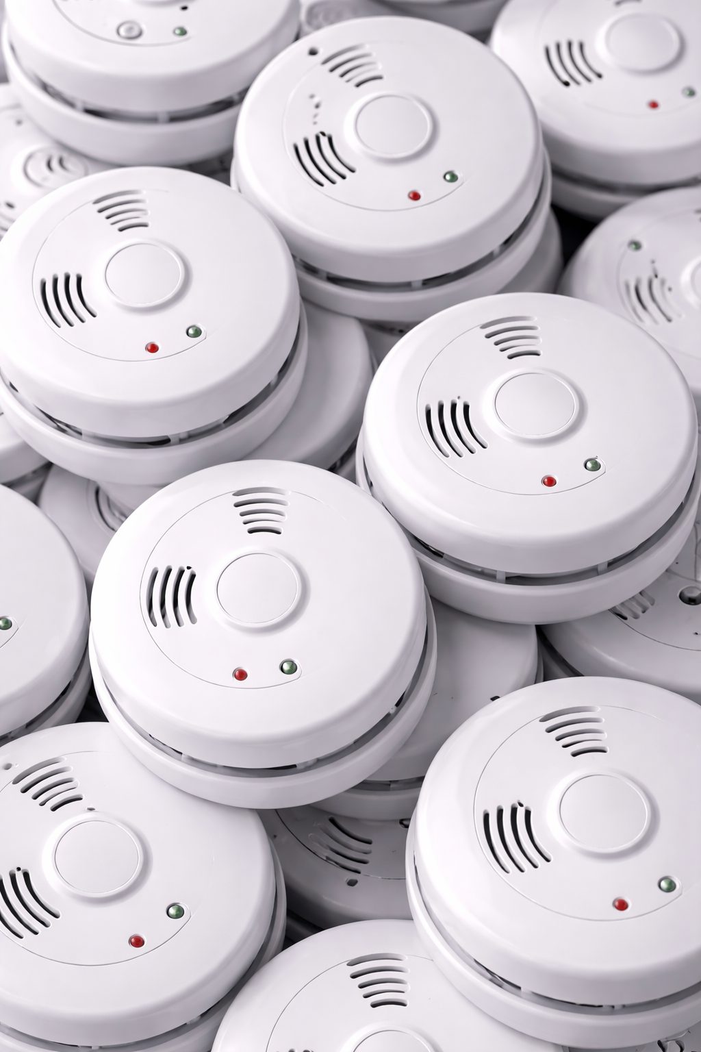 Electrician fitting a fire alarm in a Nottingham property